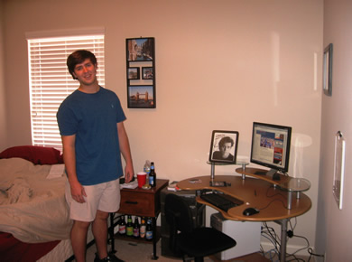 brad in his room with new computer desk
